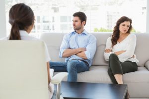 Psychologist helping a couple with relationship difficulties in